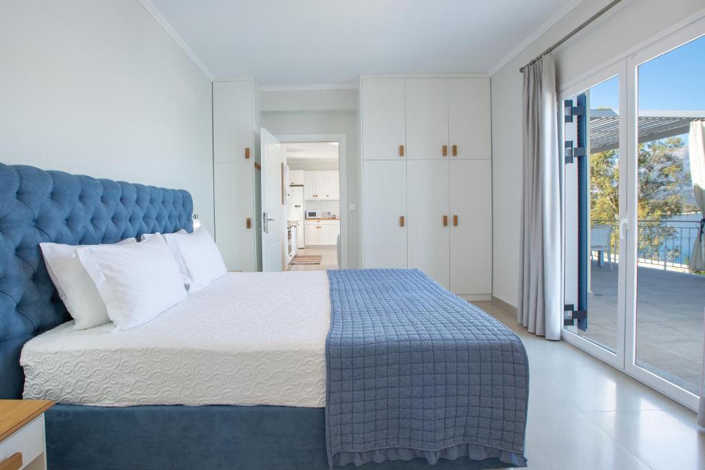 Posteľ alebo postele v izbe v ubytovaní Kavos House