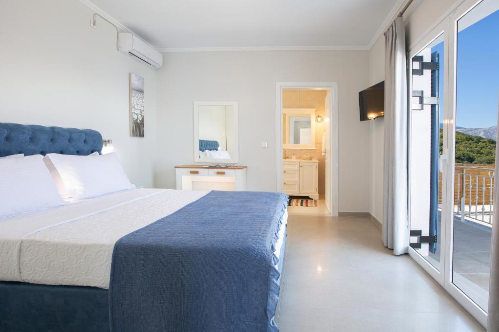 Posteľ alebo postele v izbe v ubytovaní Kavos House