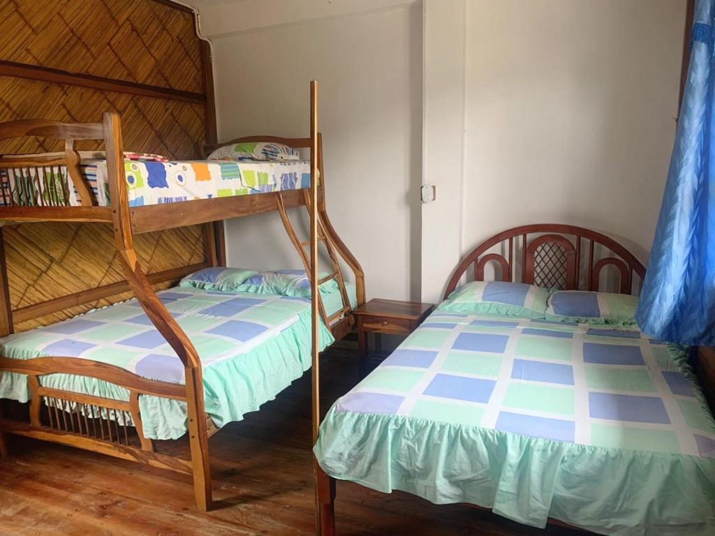 Postel nebo postele na pokoji v ubytování Hostal Mirada al Mar