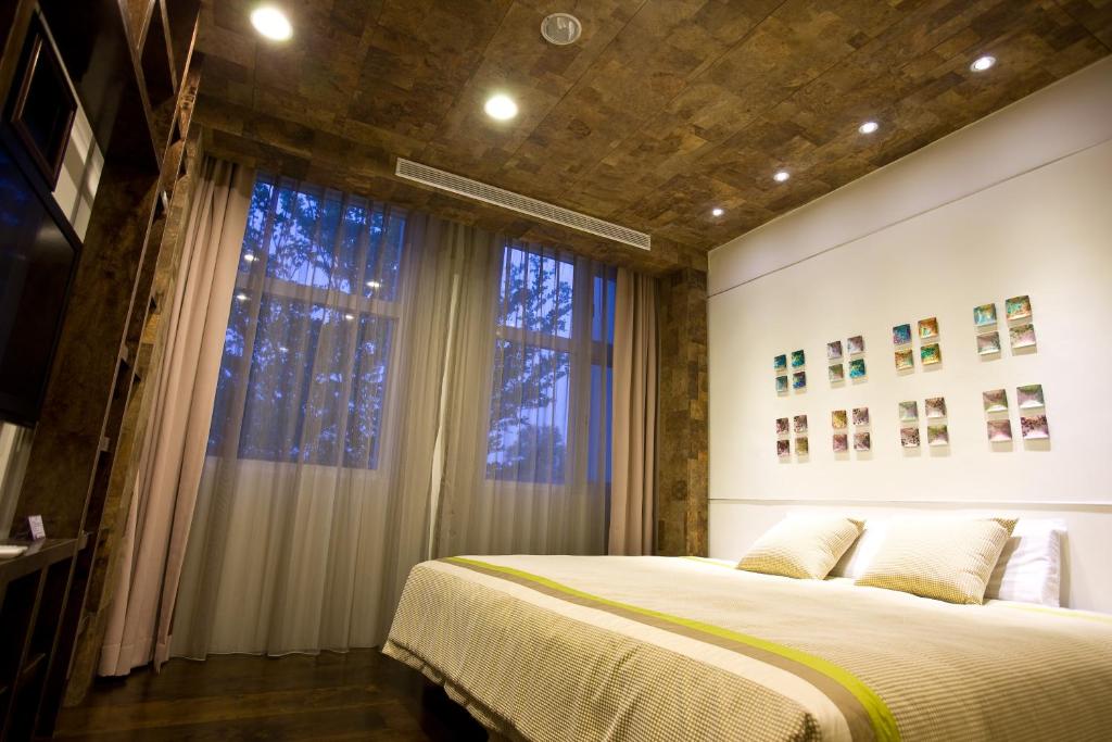 Postel nebo postele na pokoji v ubytování Zhi Da Craft Service Guest House