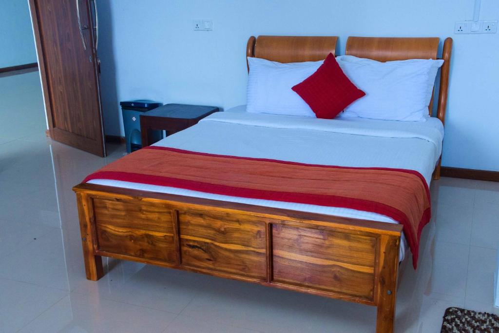 Postel nebo postele na pokoji v ubytování Rawan Face Hotel Ella