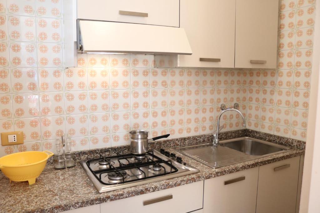 A kitchen or kitchenette at Beautiful villa just few steps from the beach