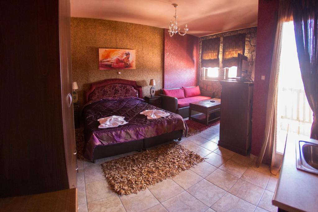 Ένα ή περισσότερα κρεβάτια σε δωμάτιο στο Silva Suites