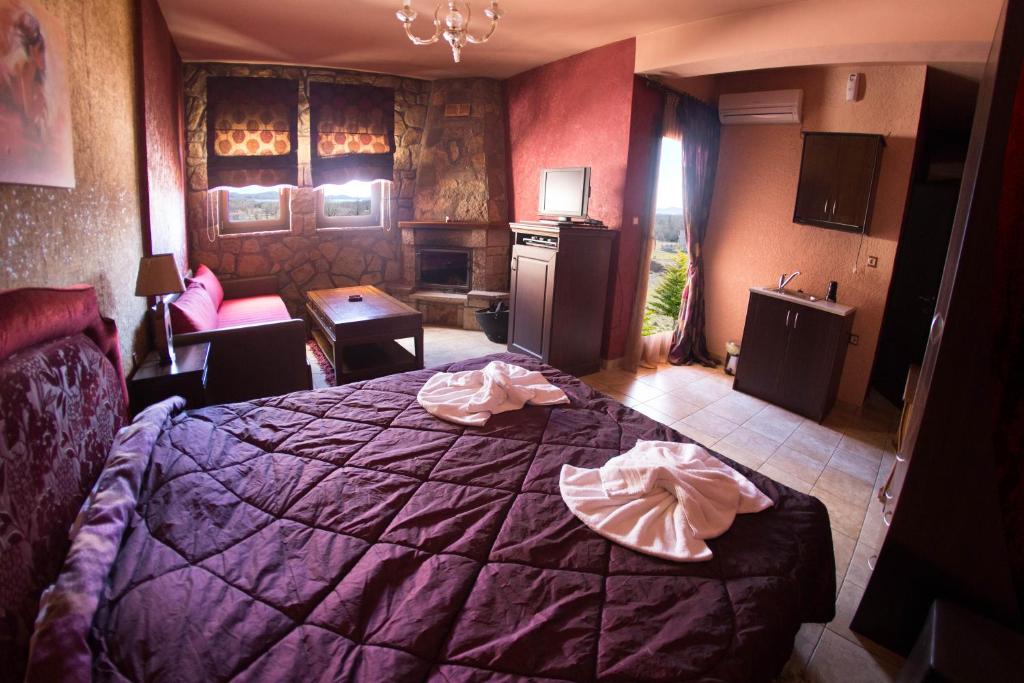 Ένα ή περισσότερα κρεβάτια σε δωμάτιο στο Silva Suites