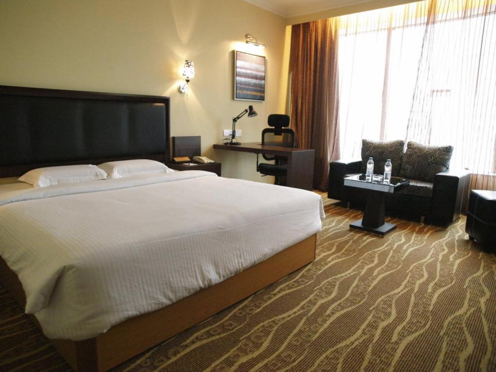 Postel nebo postele na pokoji v ubytování New York Hotel