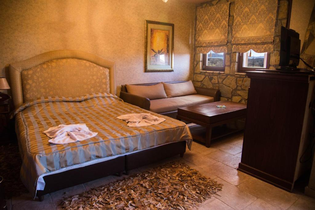 Ένα ή περισσότερα κρεβάτια σε δωμάτιο στο Silva Suites