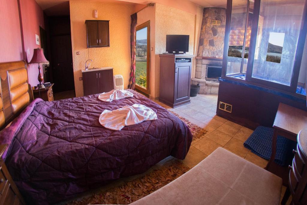 Ένα ή περισσότερα κρεβάτια σε δωμάτιο στο Silva Suites
