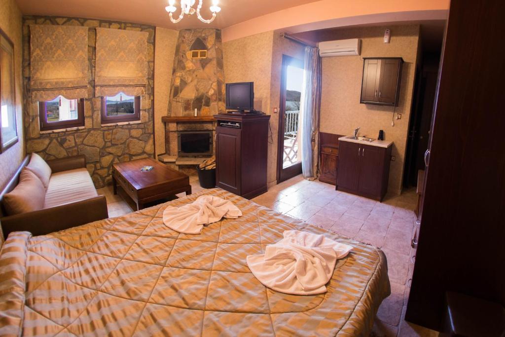 Ένα ή περισσότερα κρεβάτια σε δωμάτιο στο Silva Suites