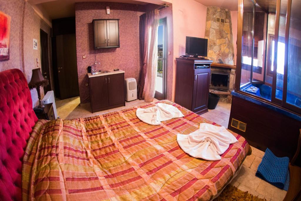 Ένα ή περισσότερα κρεβάτια σε δωμάτιο στο Silva Suites