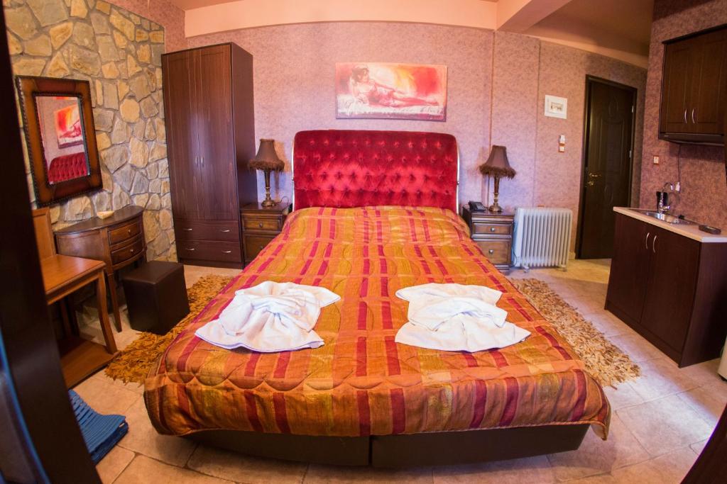 Ένα ή περισσότερα κρεβάτια σε δωμάτιο στο Silva Suites