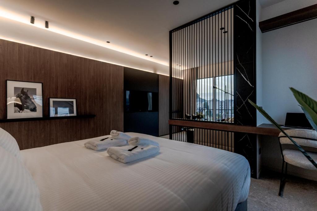 Uma cama ou camas num quarto em Athinaion Recreation Suites