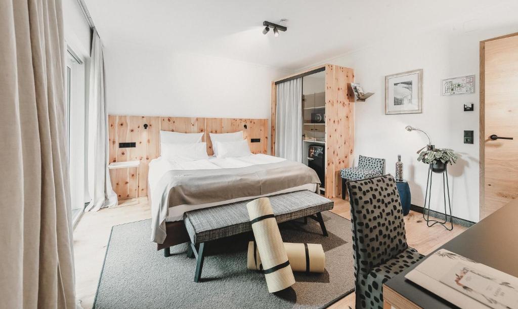 Postel nebo postele na pokoji v ubytování Hotel & Appartements Tiroler Buam