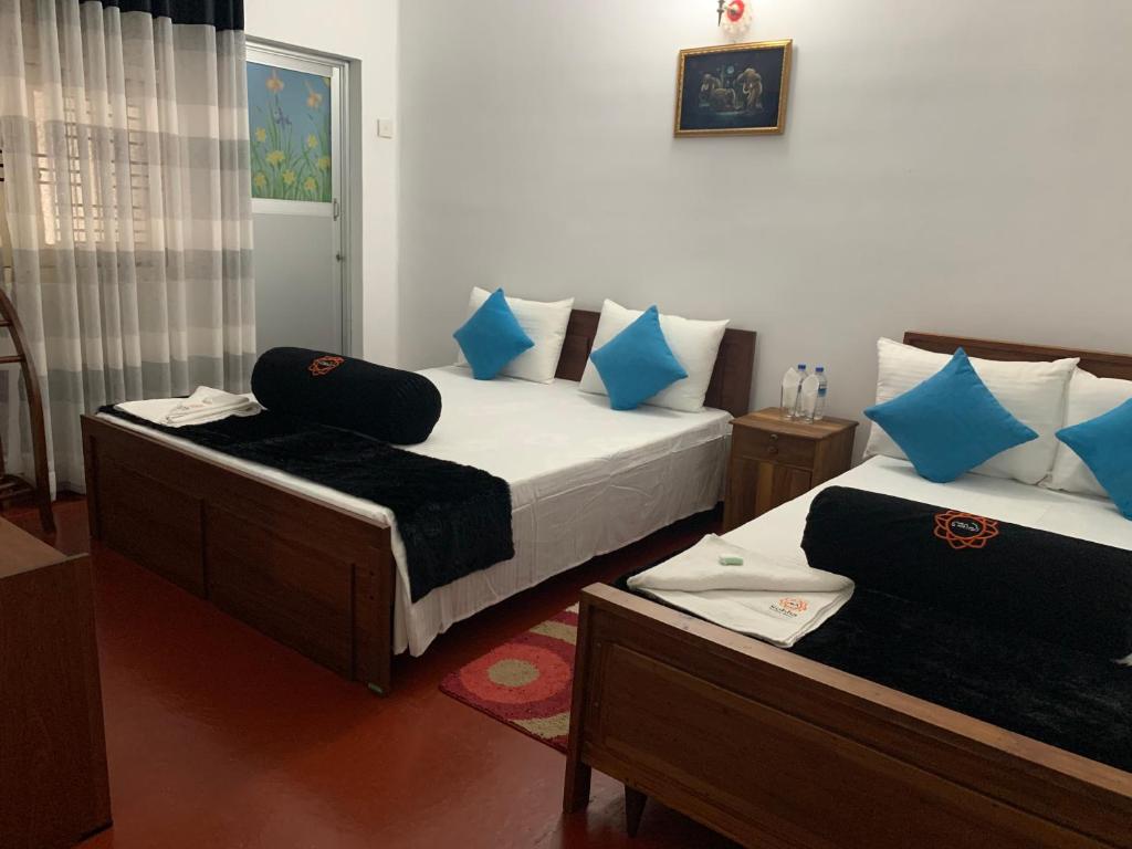 Postel nebo postele na pokoji v ubytování Sobha Holiday Home