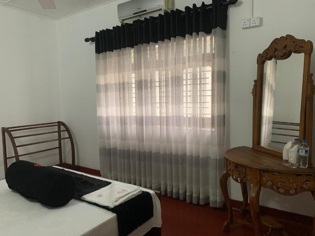 Postel nebo postele na pokoji v ubytování Sobha Holiday Home