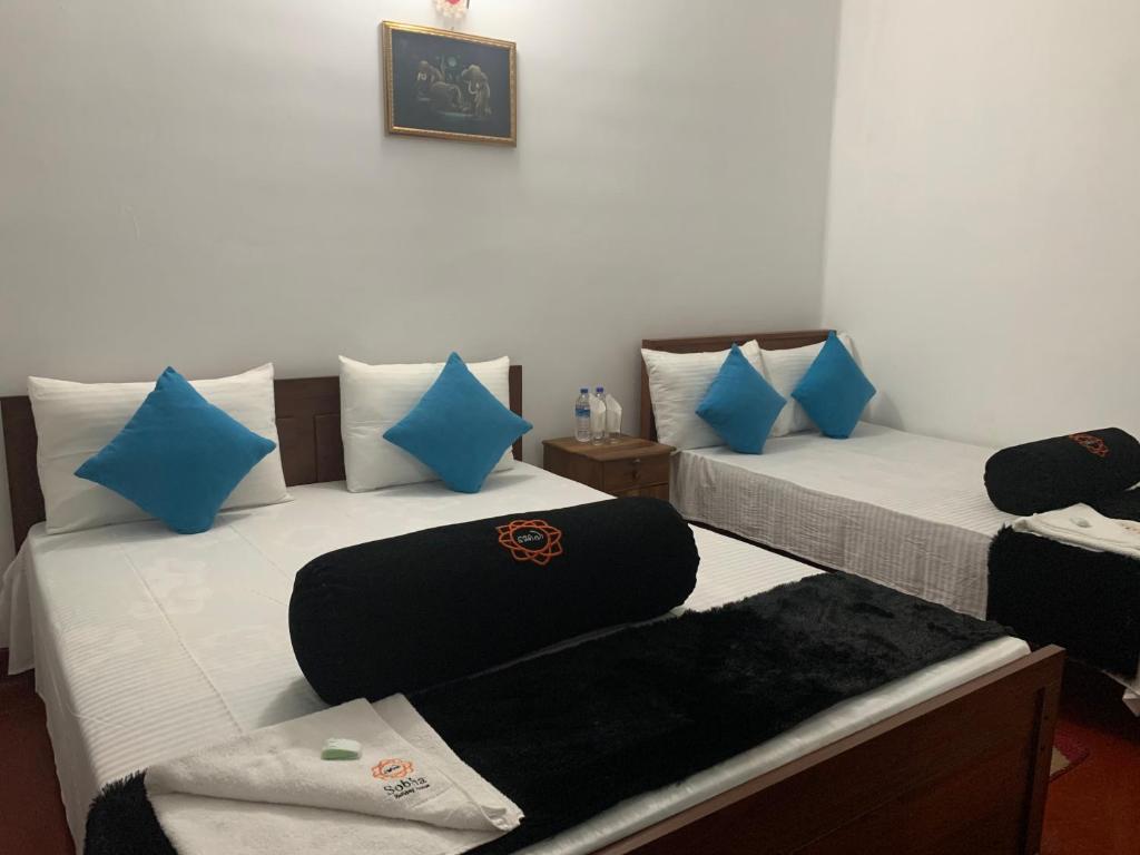 Postel nebo postele na pokoji v ubytování Sobha Holiday Home