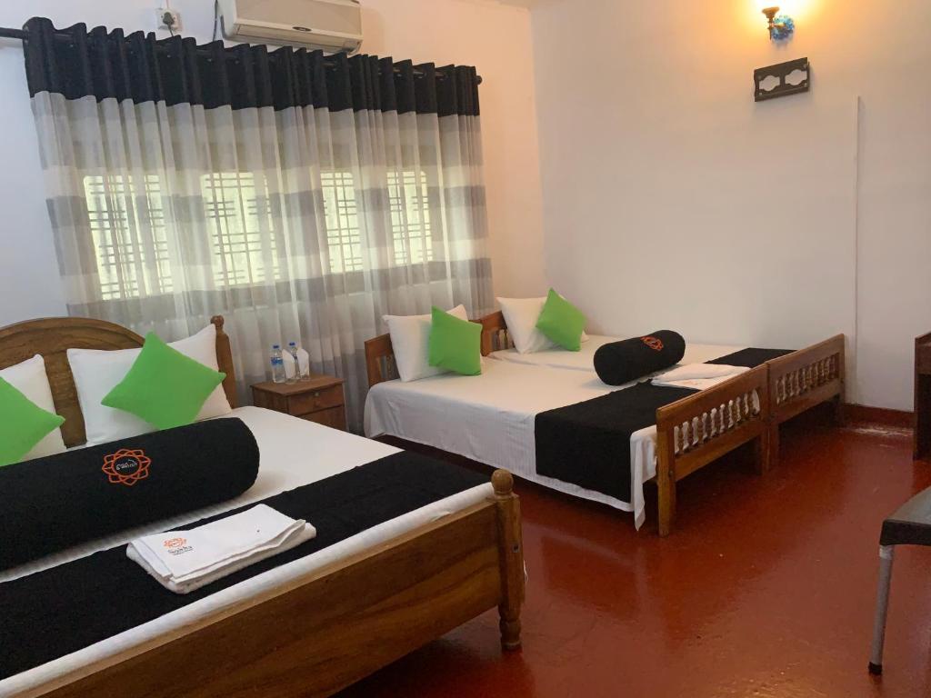 Postel nebo postele na pokoji v ubytování Sobha Holiday Home
