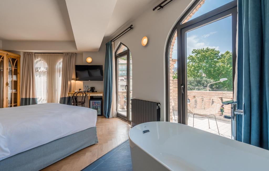 Postel nebo postele na pokoji v ubytování Abanotubani Boutique hotel