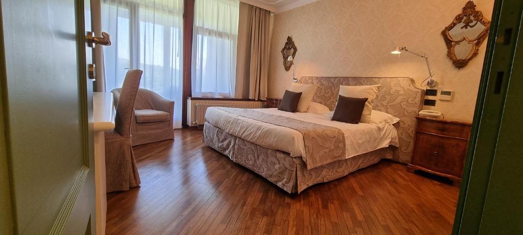 Ένα ή περισσότερα κρεβάτια σε δωμάτιο στο Relais I Due Roccoli