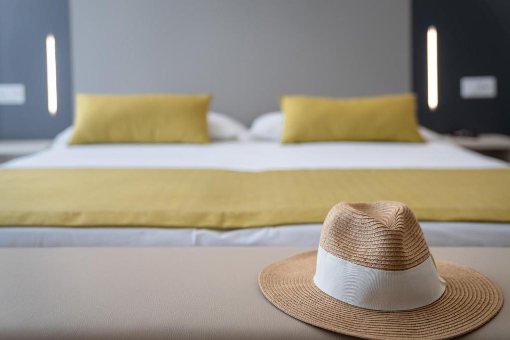 Postel nebo postele na pokoji v ubytování Hotel Marisa