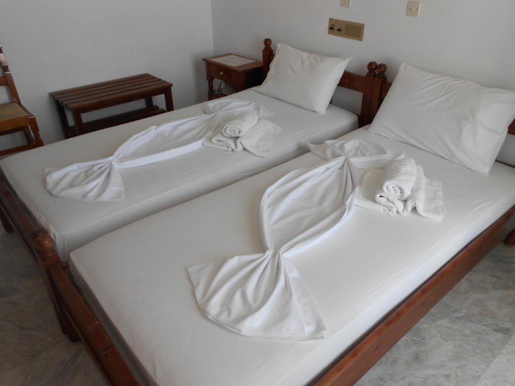 Ένα ή περισσότερα κρεβάτια σε δωμάτιο στο Zorbas Hotel