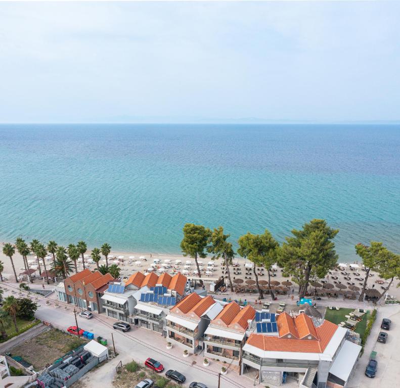 an aerial view of a resort and the ocean at Tridente Mare Apart Hotel in Pefkohori