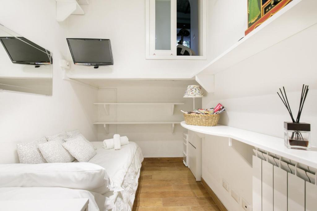Televízia a/alebo spoločenská miestnosť v ubytovaní Leopardo 28 - Loft in Trastevere