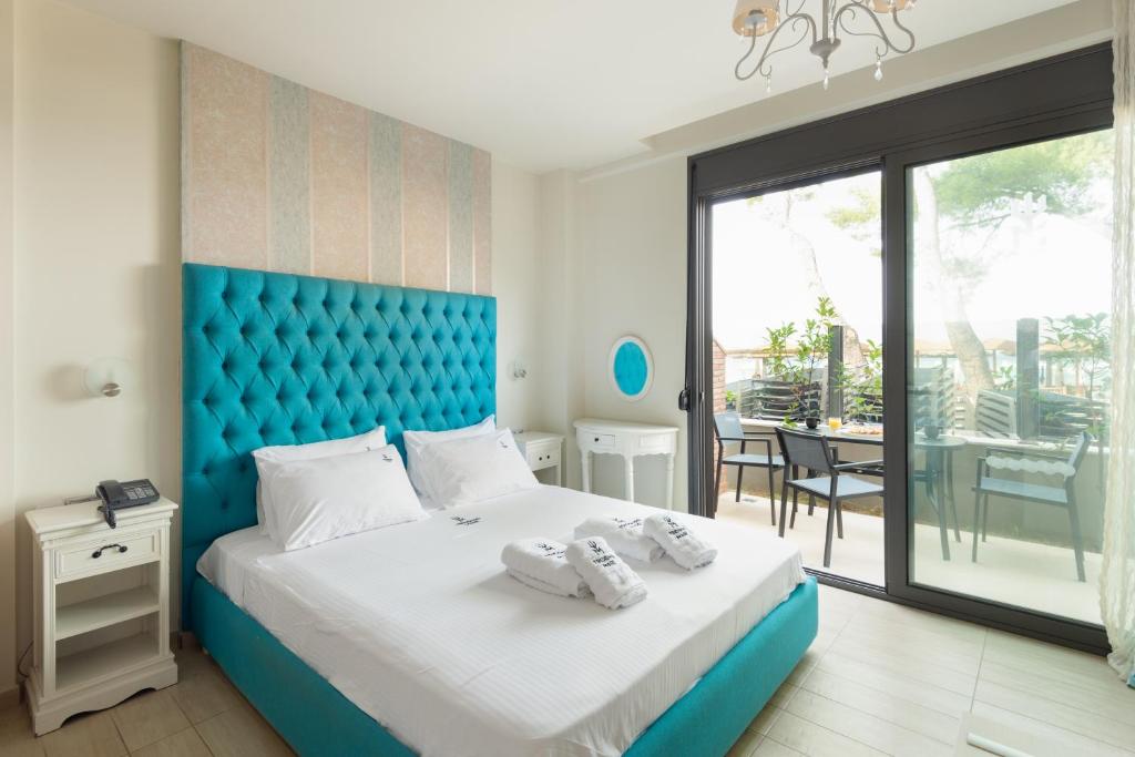 Voodi või voodid majutusasutuse Tridente Mare Apart Hotel toas