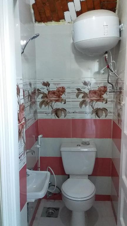 a bathroom with a toilet and a sink at Roma House in Aswan