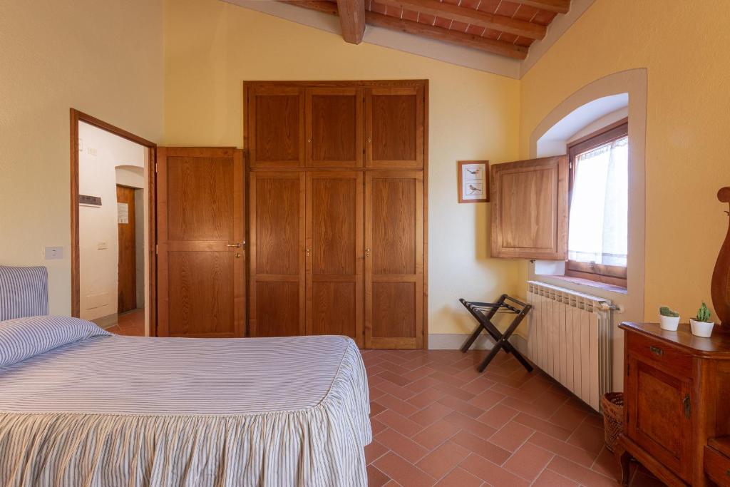 Postel nebo postele na pokoji v ubytování Agriturismo I Bonsi