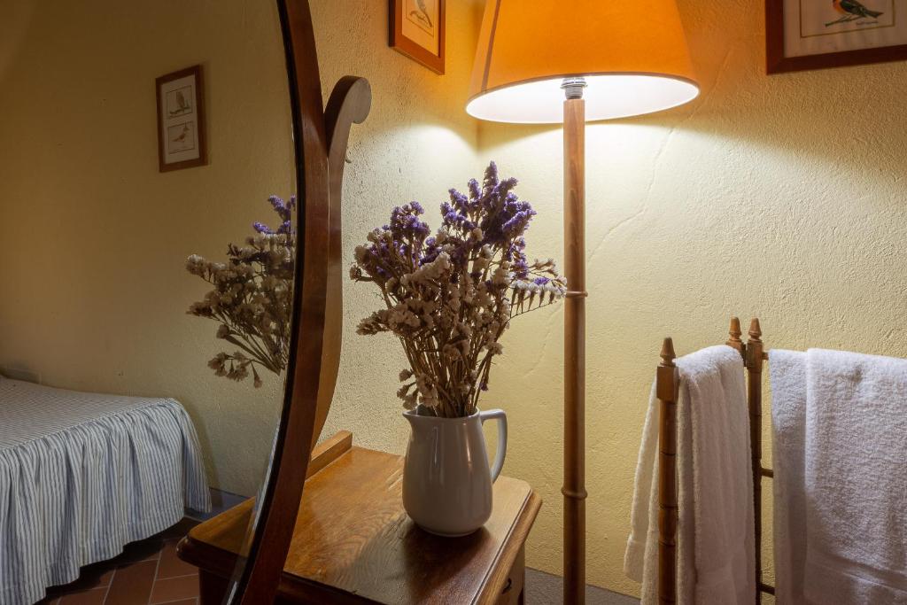 Postel nebo postele na pokoji v ubytování Agriturismo I Bonsi