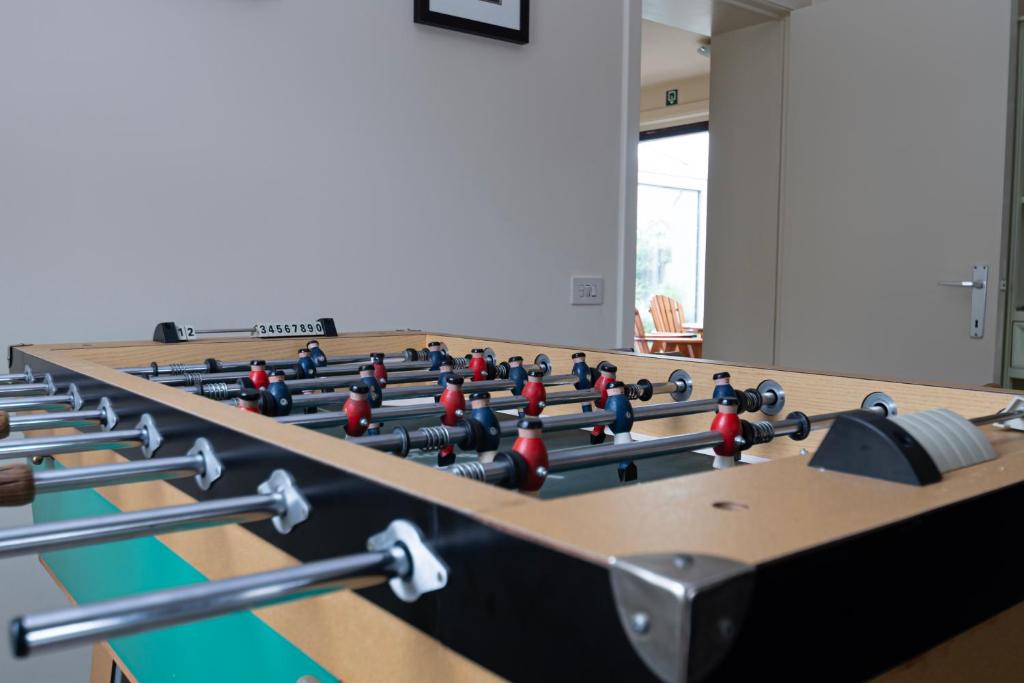 a room with a row of tables with balls on them at Huize Porteman in Staden