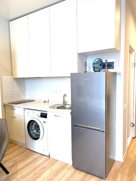 Kuchyň nebo kuchyňský kout v ubytování Mira Apart-Hotel