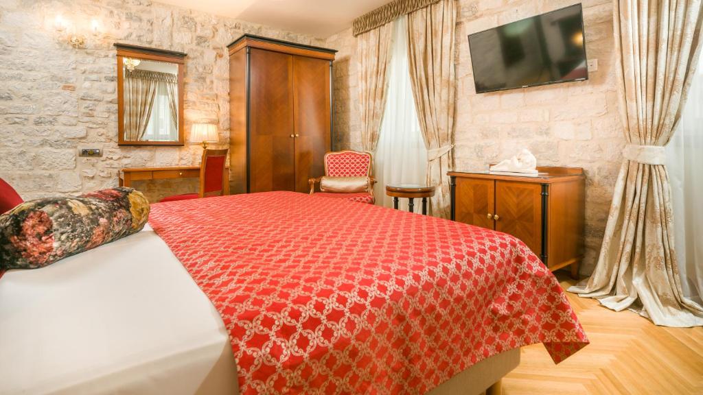 Posteľ alebo postele v izbe v ubytovaní Judita Palace Heritage Hotel