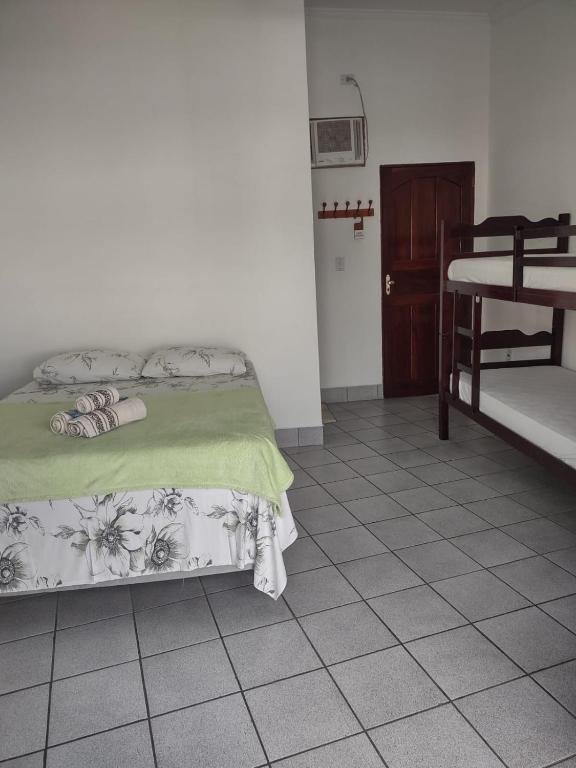 Postel nebo postele na pokoji v ubytování Pousada Caravelas - Centro de Paraty