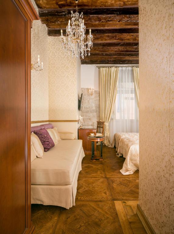 Posteľ alebo postele v izbe v ubytovaní Judita Palace Heritage Hotel