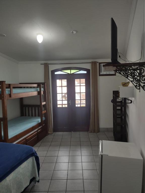 Postel nebo postele na pokoji v ubytování Pousada Caravelas - Centro de Paraty