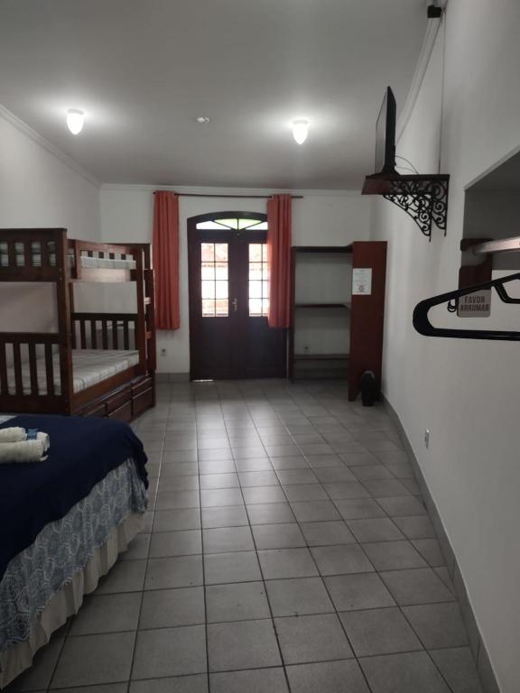 Postel nebo postele na pokoji v ubytování Pousada Caravelas - Centro de Paraty