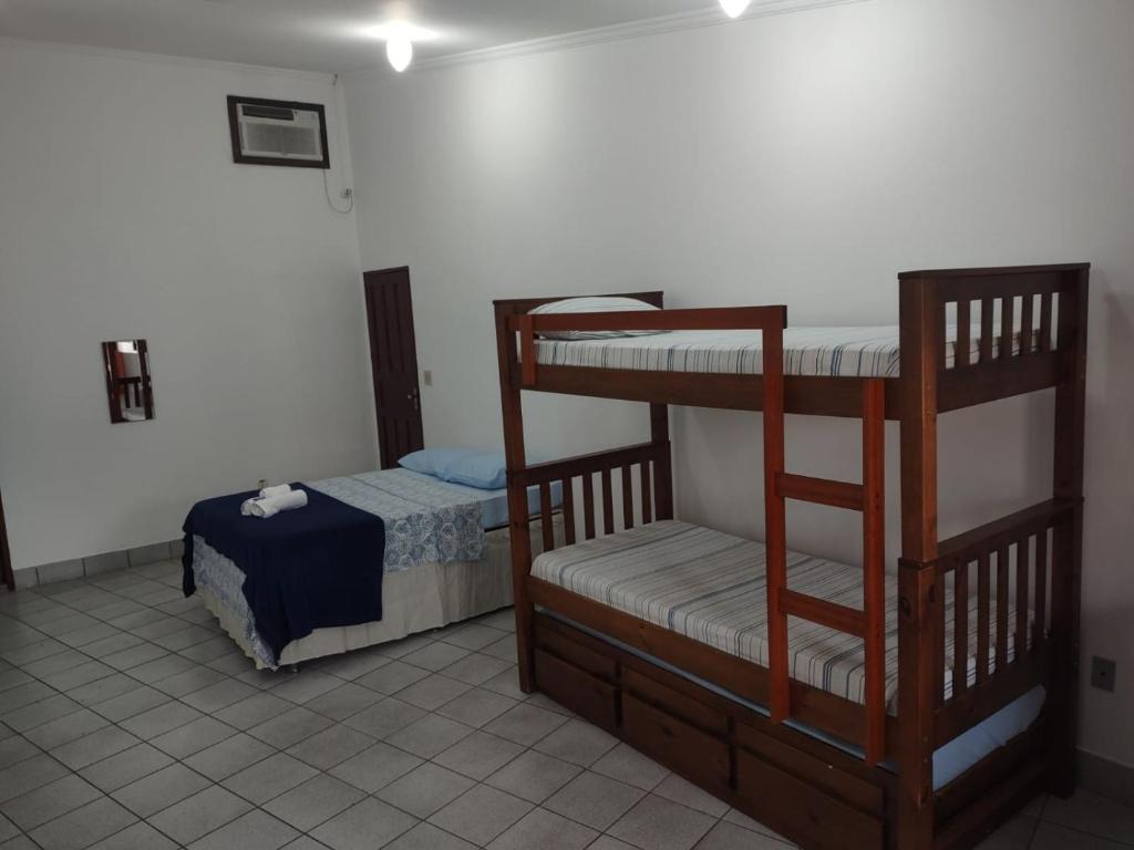 Postel nebo postele na pokoji v ubytování Pousada Caravelas - Centro de Paraty