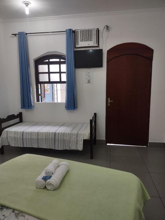Postel nebo postele na pokoji v ubytování Pousada Caravelas - Centro de Paraty