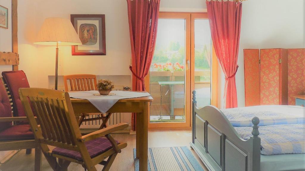 Postel nebo postele na pokoji v ubytování Hotel garni Floriani