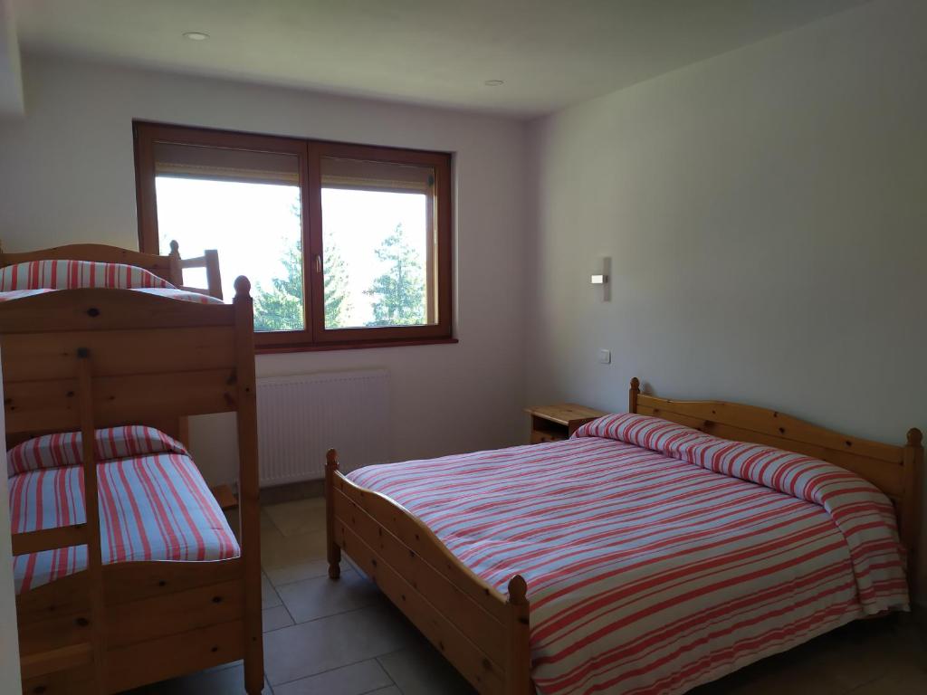 Postel nebo postele na pokoji v ubytování Al Tajol