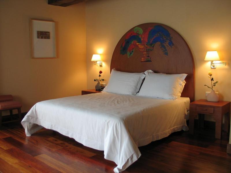 Postel nebo postele na pokoji v ubytování Hotel El Rancho