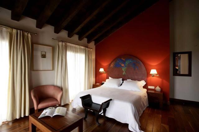 Postel nebo postele na pokoji v ubytování Hotel El Rancho