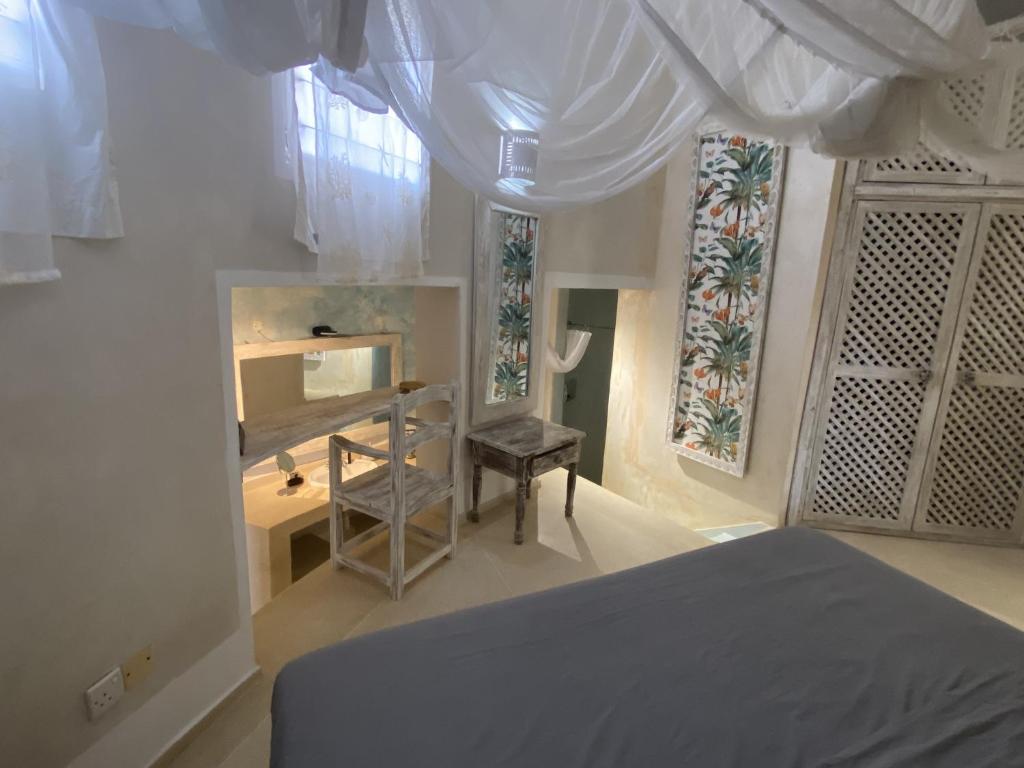 Postel nebo postele na pokoji v ubytování Watamu Shell House