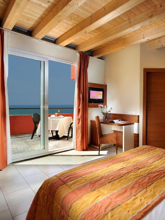 Postel nebo postele na pokoji v ubytování Hotel Bembo