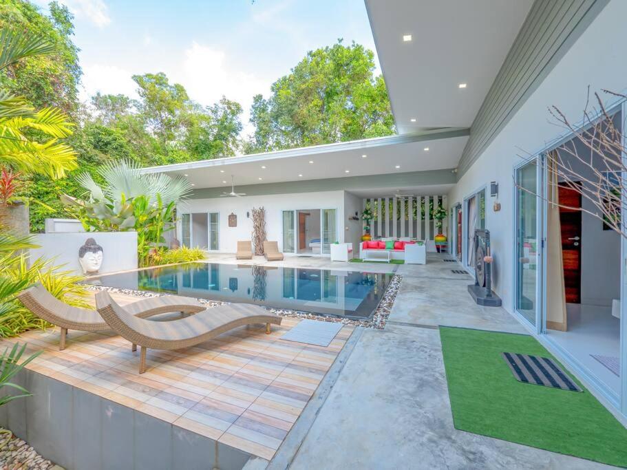 a home with a swimming pool and a house at VILLA MÉLÉTÉ - Family Home 3 bedrooms Koh Samui in Lamai