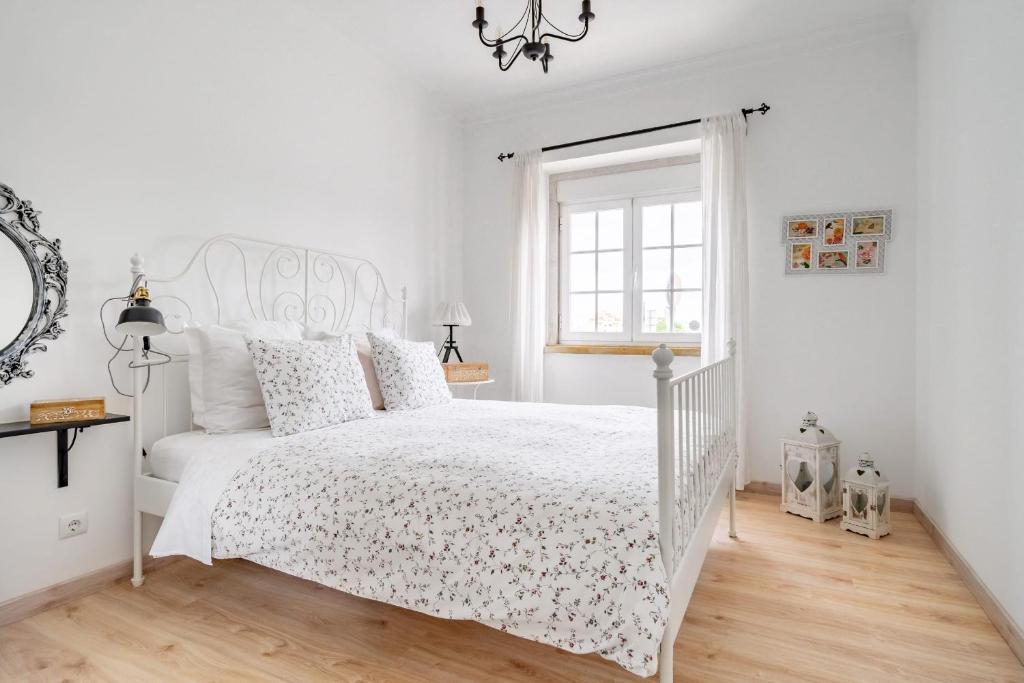 Postel nebo postele na pokoji v ubytování I Love Lisboa Apartment NEW AC