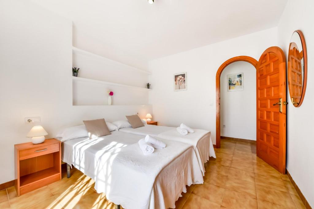 Postel nebo postele na pokoji v ubytování Villas Guzman Ismael