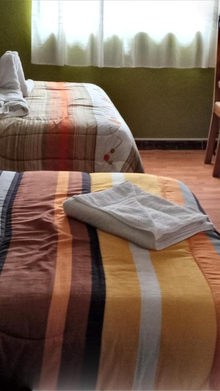 Postel nebo postele na pokoji v ubytování Casa Salkantay Cusco