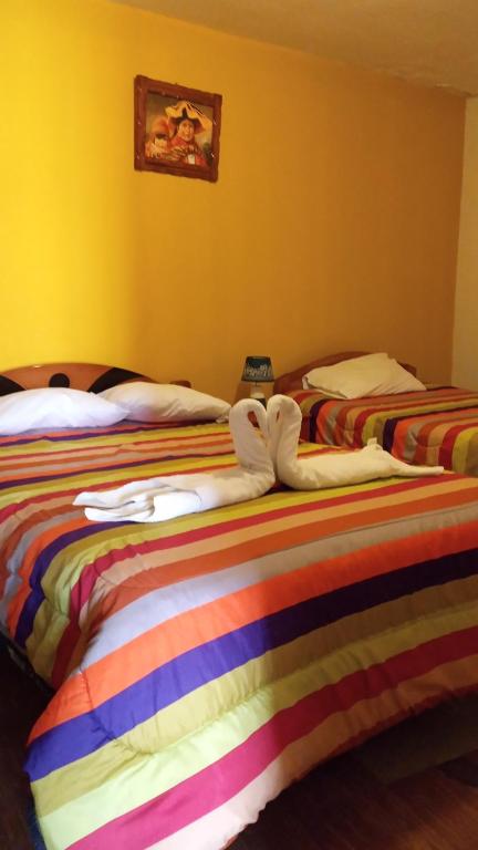 Postel nebo postele na pokoji v ubytování Casa Salkantay Cusco
